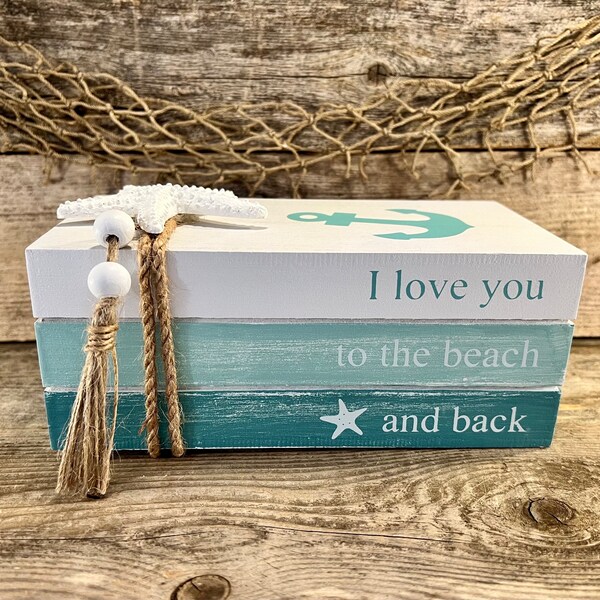 I Love You To The Beach And Back Handmade Distressed Blue and White Faux Wood Book Stack with Starfish, Anchor, Beads and Tassel