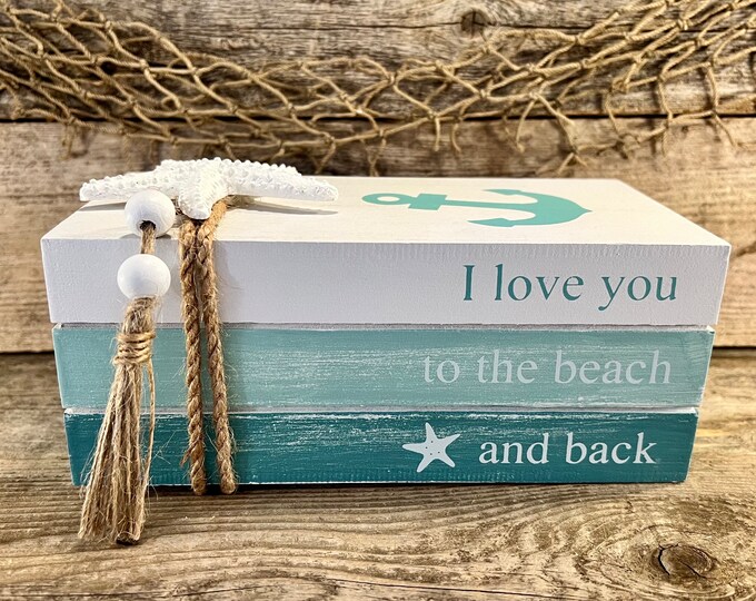 I Love You To The Beach And Back Handmade Distressed Blue and White Faux Wood Book Stack with Starfish, Anchor, Beads and Tassel