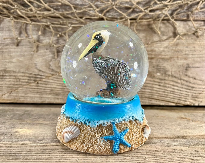 Beach and Seashells Resin and Glass Coastal Brown Pelican Water Globe