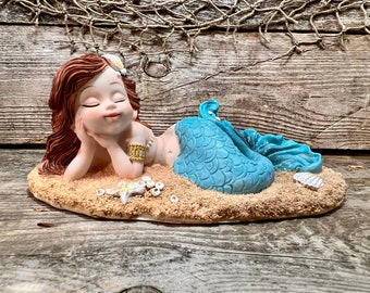 Resin Daydreaming Mermaid with Teal Fantail Resting On Beach Tabletop Statuette