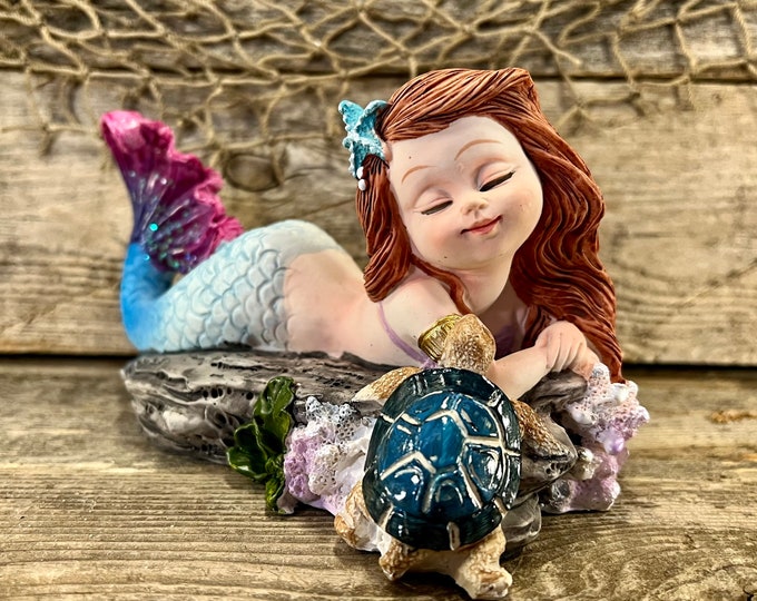 Resin Relaxing Blue and Purple Sparkling Tail Mermaid with Blue Baby Sea Turtle Friend Tabletop Statuette