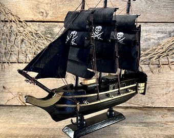 Handmade Black Wooden Pirate Ship On Stand with Gold Accents and Jolly Roger Sails and Anchors