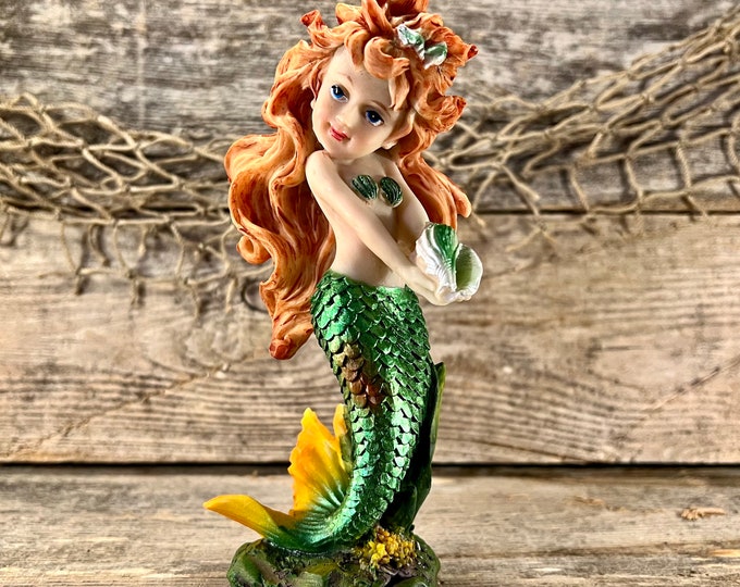 Standing Resin Mermaid with Red Flowing Hair Holding Seashell and Shimmering Metallic Green Tail Statuette