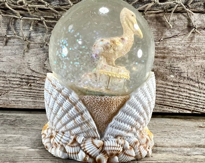 Pelican On Piling Sand and Seashells Resin and Glass Water Globe