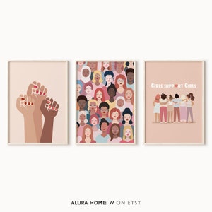 May include: Three printable wall art prints with a feminist theme. The first print features a group of raised fists in different skin tones. The second print features a pattern of diverse women's faces. The third print features a group of women with their arms around each other and the text "Girls Support Girls".