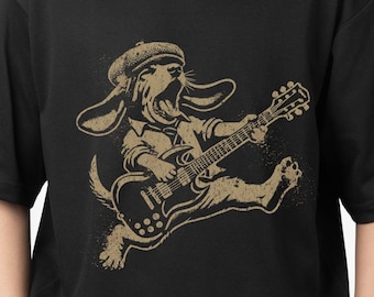 May include: Black t-shirt with a graphic print of a cartoon dog playing a guitar. The text "99 ORGANIZERS" is printed on the bottom right corner of the shirt.