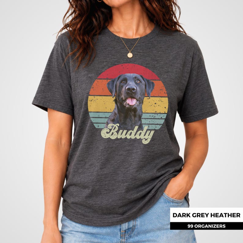 Vintage-style custom dog shirt featuring a personalized pet photo over a faded retro sunset with horizontal red, orange, yellow, and teal stripes. The pet’s name is added beneath the portrait in large cream script for a nostalgic personalized look. A custom dog or cat tee for pet owners, dog moms and dads, cat lovers, birthday gifts, pet memorials, adoption celebrations, and thoughtful keepsakes made from a favorite companion photo.
