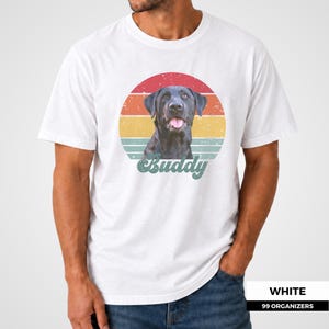 Custom pet shirt featuring a personalized dog or cat portrait in front of a colorful distressed sunset inspired by vintage 1970s graphics. Warm red, orange, yellow, and teal bands frame the pet, while a large custom name in retro script completes the design. A meaningful pet photo gift for dog moms, dog dads, cat parents, birthdays, holidays, memorial keepsakes, adoption anniversaries, and anyone who wants a personalized portrait of a beloved animal.