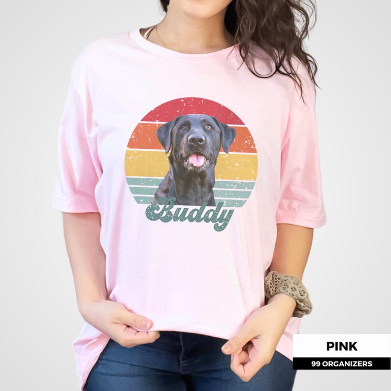 Custom dog photo shirt featuring a personalized pet portrait with a distressed vintage sunset graphic behind the animal and a large script name underneath. Muted red, orange, yellow, and teal stripes create a nostalgic retro look while keeping the pet as the focal point. A personalized dog or cat gift for pet parents, birthdays, dog moms and dads, cat lovers, memorial keepsakes, adoption celebrations, and people who want a unique shirt made from their own pet photo.