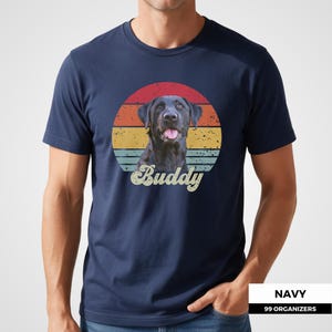 Retro personalized pet shirt featuring a custom dog or cat portrait against a circular sunset with distressed red, orange, yellow, and teal bands. The pet’s custom name appears below in oversized cream script lettering, creating a classic vintage-inspired composition. A meaningful photo gift for dog owners, cat parents, pet lovers, birthdays, holidays, adoption anniversaries, pet memorials, and anyone who wants to celebrate a beloved companion with personalized artwork.