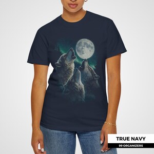 Stunning hand-drawn wolves mid-howl beneath a textured moon and soft teal sky, with dark forest silhouettes in the background. A powerful nature scene with a vintage mystical twist — ideal for animal lovers and lovers of dreamy, feral aesthetics.