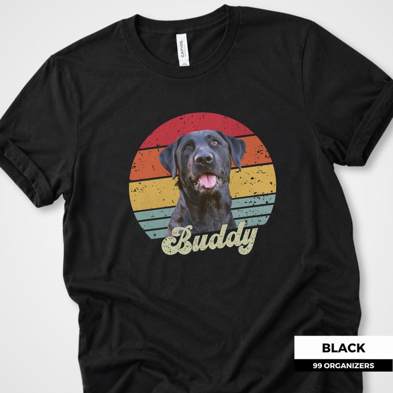 Retro custom pet shirt featuring a personalized dog or cat photo placed in front of a distressed sunset circle with warm red, orange, yellow, and muted teal stripes. The pet’s name is displayed below in oversized vintage script lettering. A unique personalized pet portrait tee for dog lovers, cat owners, pet parents, birthdays, custom pet gifts, memorial keepsakes, and anyone who wants a favorite animal photo transformed into a nostalgic graphic design.