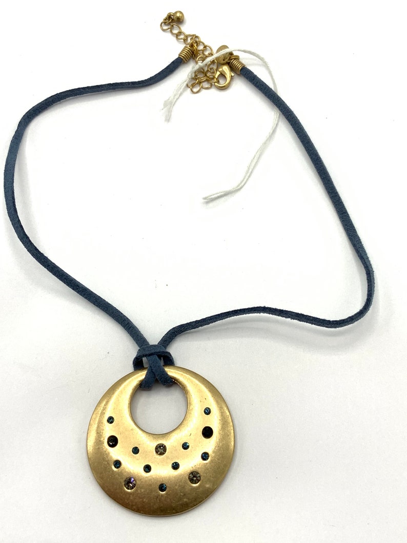 Round Gold tone with rhinestone with blue lace necklace by Lia Sophia.