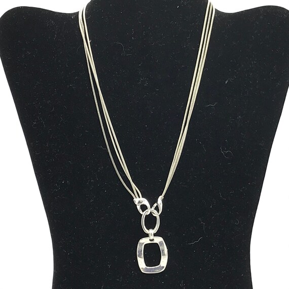 Silver tone and multiple chain with a pendant by … - image 8