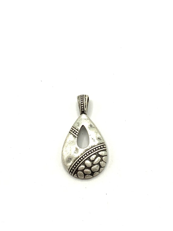 Gorgeous collectible nickel hammered pendant by Lia Sophia as teardrop.