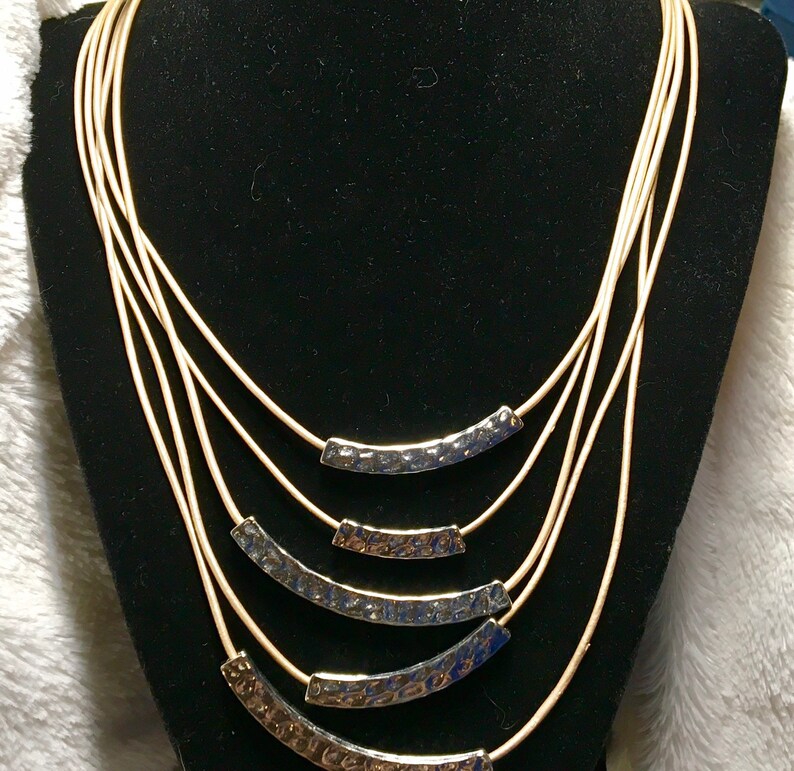 Lia Sophia multi-stand necklace gold and silver tone.