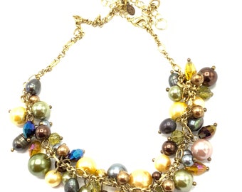 Gorgeous multicolored pearl necklace  by Premier Designed , gold tone, brown, cream, green pearl.