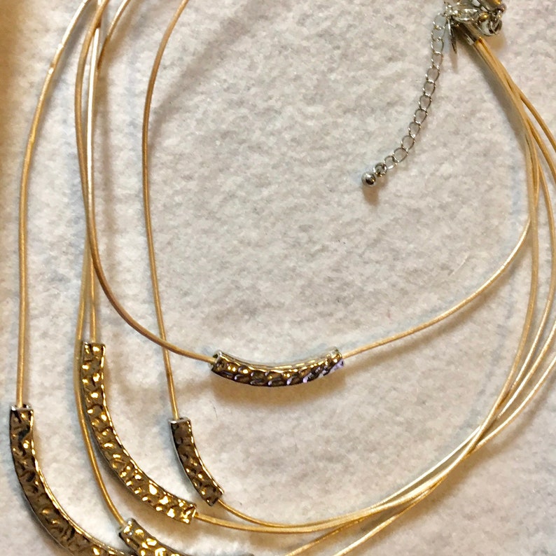 Lia Sophia multi-stand necklace gold and silver tone.