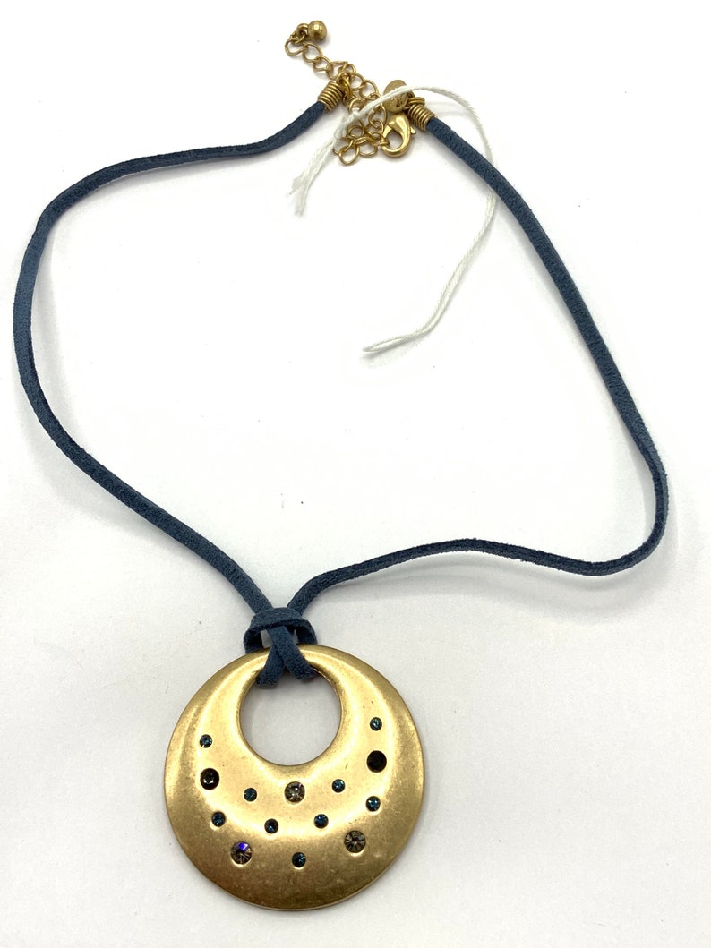 Round Gold tone with rhinestone with blue lace necklace by Lia Sophia.