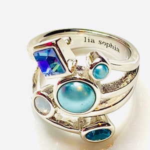 Multicolored crystal with pearl  and silver tone ring by Lia Sophia , signed