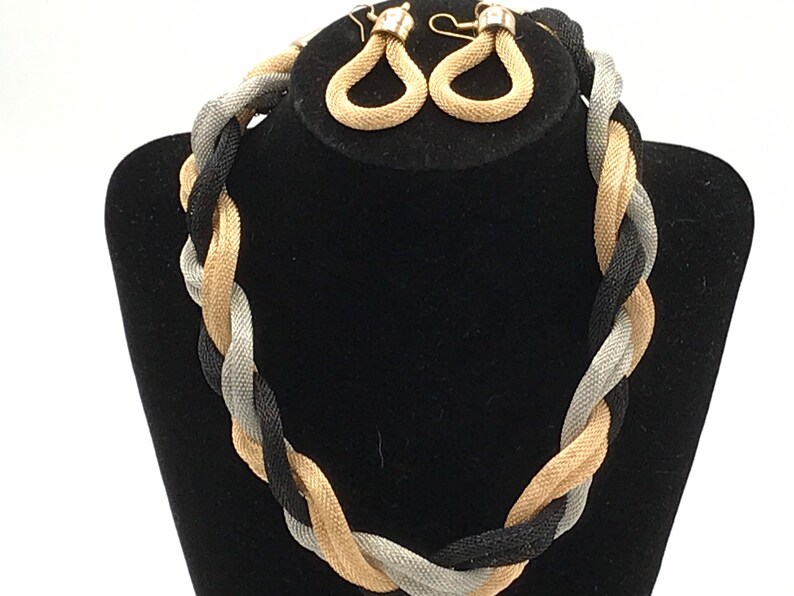 tree tones. Vintage braided metal chain necklace and earrings