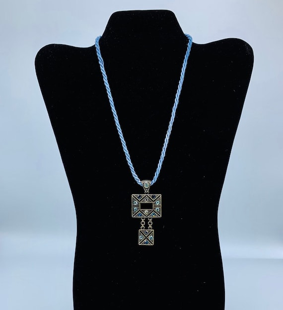 Gorgeous collectible and vintage Lia Sophia blue light and brass tone necklace with rhinestone. New with tag. View 5