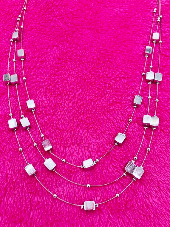 Lia Sophia multi-stand necklace gold and silver tone.