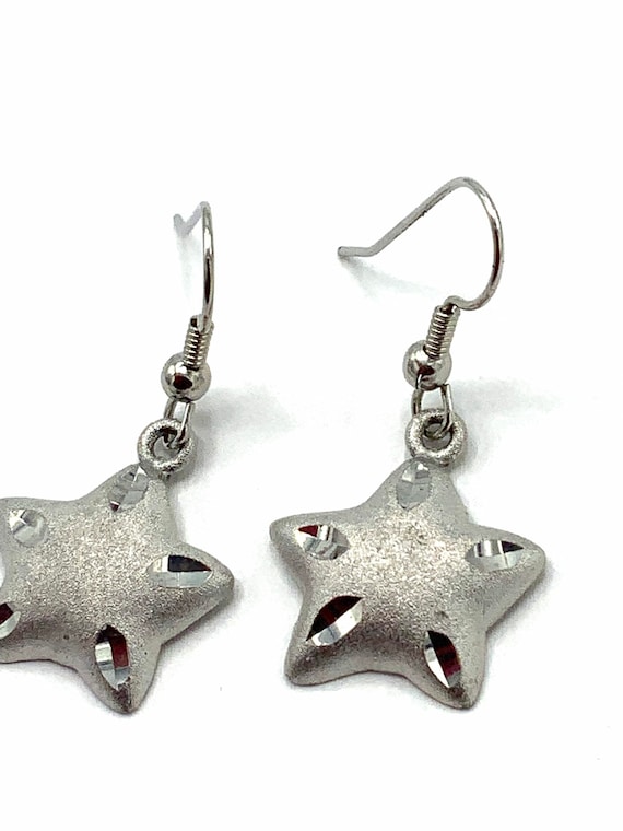 Gorgeous collectible star silver tone, hoop earrings by Cookie Lee.