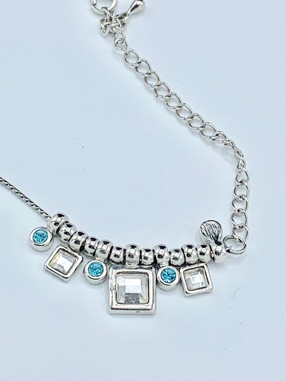 Lia Sophia blue light and silver  tone necklace