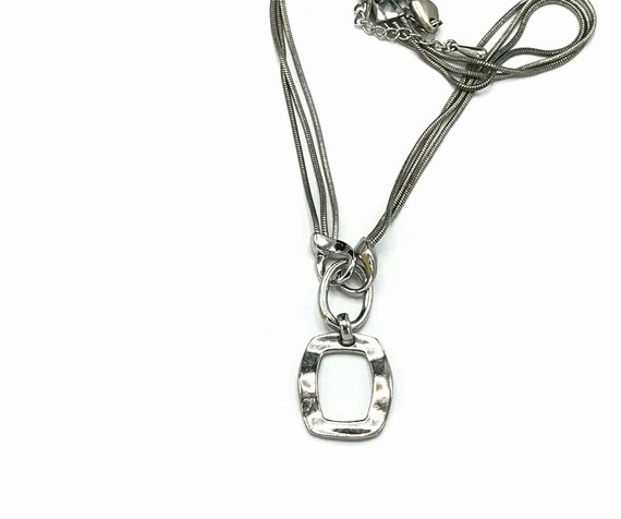 Silver tone and multiple chain with a pendant by … - image 5