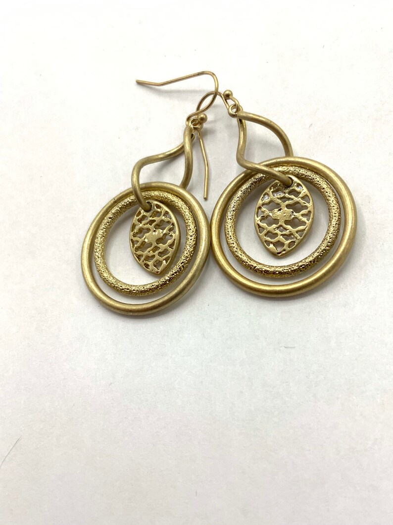 Gorgeous collectible and vintage old gold tone earrings by Lia Sophia, hoop, carved, round. image 6