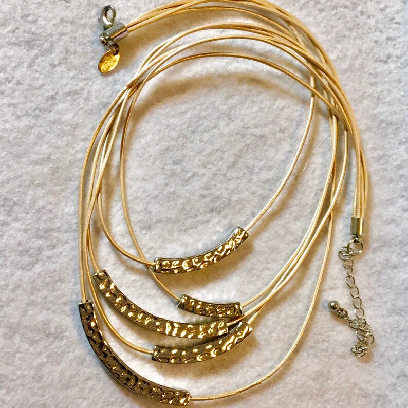 Lia Sophia multi-stand necklace gold and silver tone.