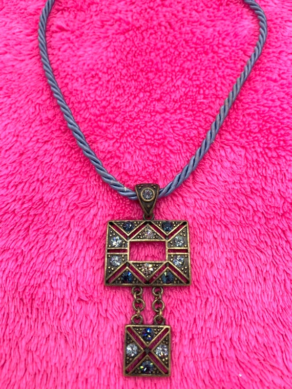Gorgeous collectible and vintage Lia Sophia blue light and brass tone necklace with rhinestone. New with tag. View 4
