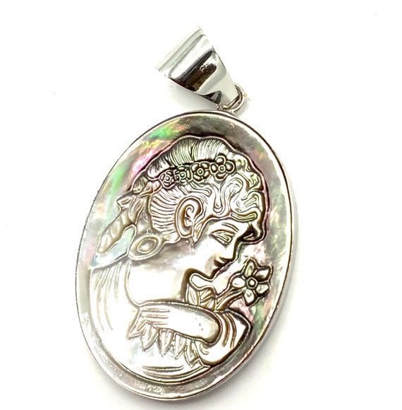 Gorgeous collectible cameo pendant by Lia Sophia and abalone.
