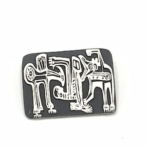 Vintage silver tone brooch by Alice Seely.