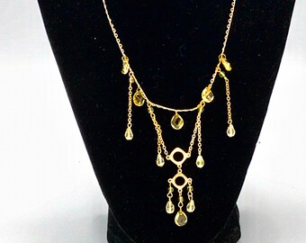 Tassels beads necklace by Cookie Lee, yellow and gold tone.