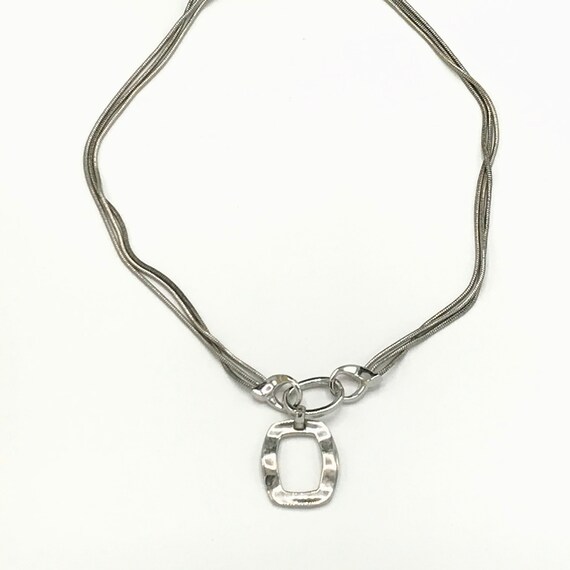 Silver tone and multiple chain with a pendant by … - image 6