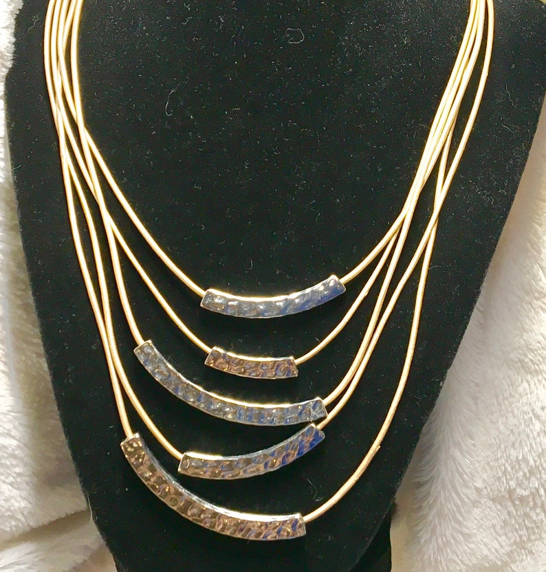 Lia Sophia multi-stand necklace gold and silver tone.