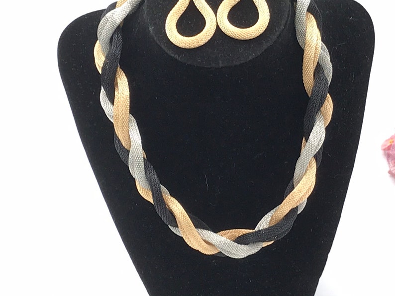tree tones. Vintage braided metal chain necklace and earrings