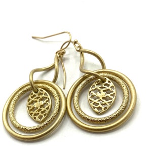 Gorgeous collectible and vintage old gold tone earrings by Lia Sophia, hoop, carved, round. image 1