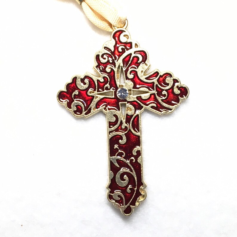 Gold tone Cross with red enamel pendant.