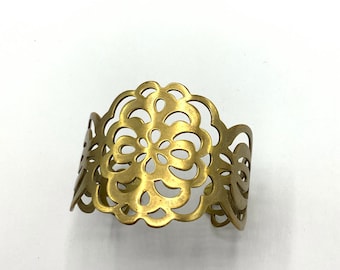 Gorgeous collectible old gold tone bracelet by Lia Sophia, cuff, carved.