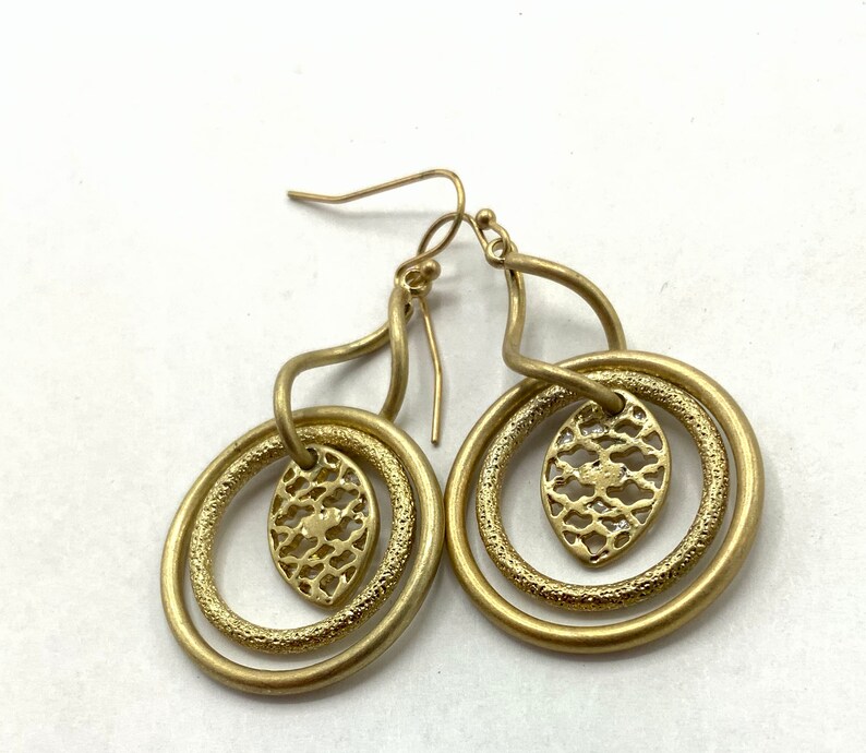 Gorgeous collectible and vintage old gold tone earrings by Lia Sophia, hoop, carved, round. image 3