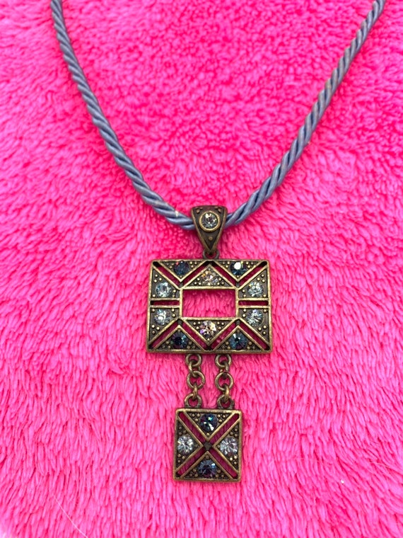 Gorgeous collectible and vintage Lia Sophia blue light and brass tone necklace with rhinestone. New with tag. View 6