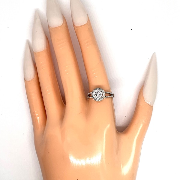 Gorgeous collectible solitaire ring by Lia Sophia, signed, clear zirconia.