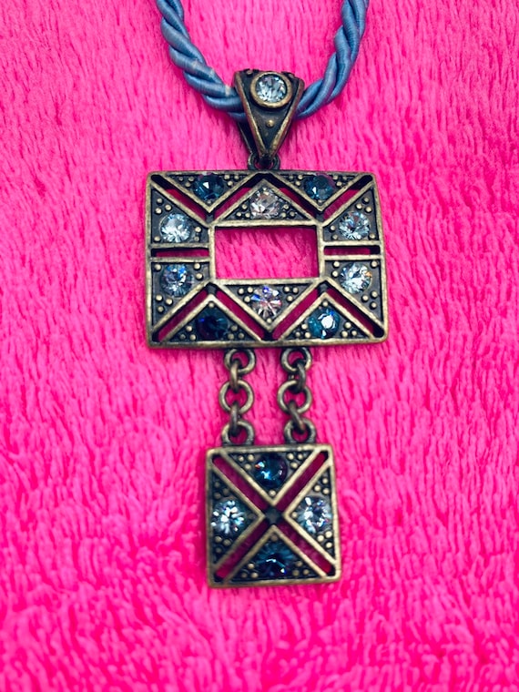 Gorgeous collectible and vintage Lia Sophia blue light and brass tone necklace with rhinestone. New with tag. View 2