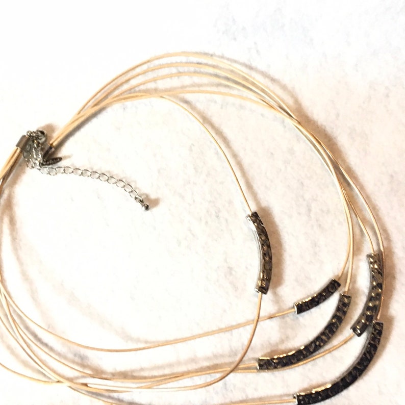 Lia Sophia multi-stand necklace gold and silver tone.