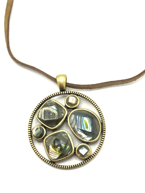 Brass round with abalone pendant with leather neck