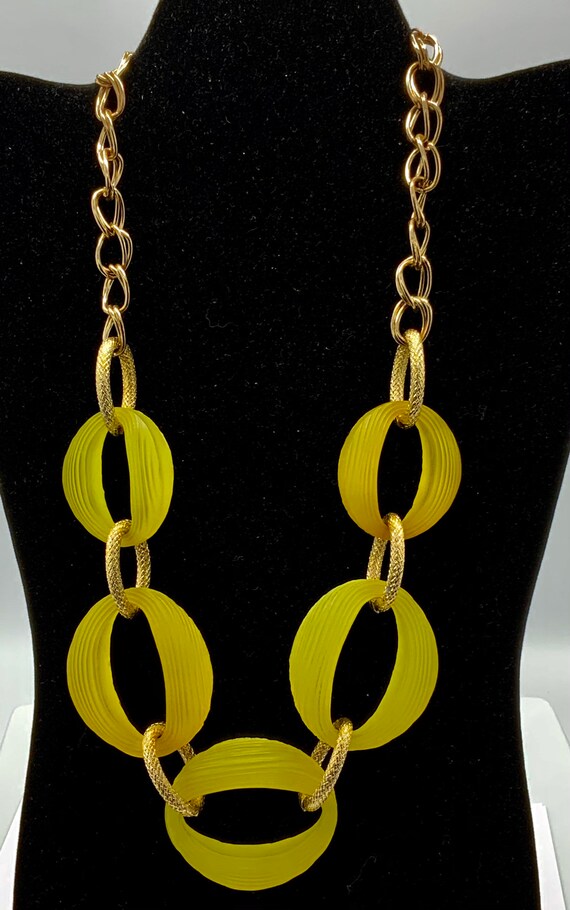 Yellow and gold tone necklace