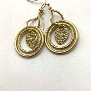 Gorgeous collectible and vintage old gold tone earrings by Lia Sophia, hoop, carved, round. image 7